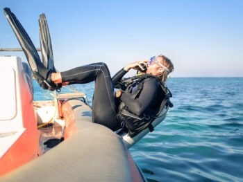 why do scuba divers dive backwards